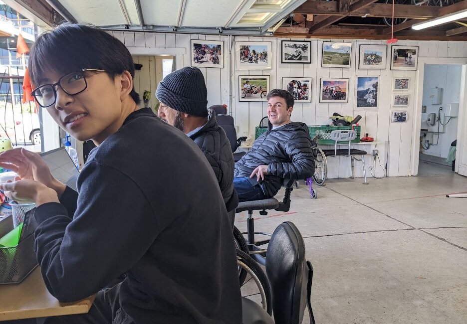 Photo of three people at the Adaptive Cycle Center.